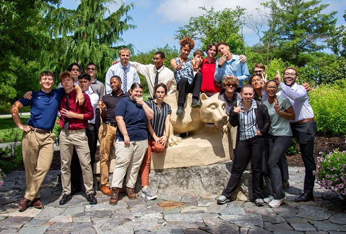 LION STEM Scholars pose for a photo with the Berks Lion Shrine.